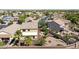 Aerial view of backyard featuring mature landscaping, a patio seating area, and privacy walls at 21019 N Sansom Dr, Maricopa, AZ 85138