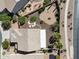 Aerial of backyard offering mature trees, a patio area, lush landscaping, and privacy, set in a quiet neighborhood at 21019 N Sansom Dr, Maricopa, AZ 85138