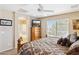 Bedroom suite featuring an ensuite bathroom and comfortable furnishings at 21019 N Sansom Dr, Maricopa, AZ 85138