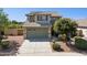 Charming two-story home featuring a well-manicured front yard, tile roof, and a spacious two-car garage at 21019 N Sansom Dr, Maricopa, AZ 85138