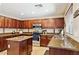 Well-equipped kitchen with stainless steel appliances, granite countertops, and ample cabinet space at 21019 N Sansom Dr, Maricopa, AZ 85138
