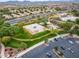 Aerial view of neighborhood park and parking area with surrounding homes at 2222 W Morse Ct, Anthem, AZ 85086