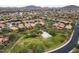 An aerial view of the neighborhood with houses and green spaces at 2222 W Morse Ct, Anthem, AZ 85086