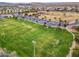 Aerial view of neighborhood sports field and baseball diamonds with surrounding homes at 2222 W Morse Ct, Anthem, AZ 85086