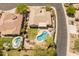 High-angle view displaying a private backyard pool, desert landscaping, and neighborhood setting at 2222 W Morse Ct, Anthem, AZ 85086