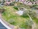Aerial view of neighborhood park featuring trees, walkways, and a basketball court at 2222 W Morse Ct, Anthem, AZ 85086
