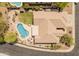 Gorgeous aerial view of backyard with pool, desert landscaping, and covered patio at 2222 W Morse Ct, Anthem, AZ 85086