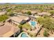 A high angle drone shot of a desert home with a back yard pool and patio area at 2222 W Morse Ct, Anthem, AZ 85086
