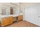 Spacious bathroom with dual sinks, a vanity area, and ample storage in the cabinets at 2222 W Morse Ct, Anthem, AZ 85086