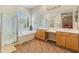 Bright bathroom features a separate shower, soaking tub, and dual sinks for convenience at 2222 W Morse Ct, Anthem, AZ 85086