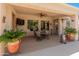 Inviting covered patio featuring a ceiling fan and outdoor dining set, perfect for relaxation at 2222 W Morse Ct, Anthem, AZ 85086