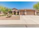 Charming single-story home with a well-maintained front yard, desert landscaping, a three-car garage, and a welcoming entrance at 2222 W Morse Ct, Anthem, AZ 85086