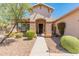 Charming home entrance featuring brick columns, desert landscaping, and a welcoming entryway at 2222 W Morse Ct, Anthem, AZ 85086