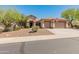 Charming single-story home featuring a three-car garage, desert landscaping, and a welcoming entrance at 2222 W Morse Ct, Anthem, AZ 85086