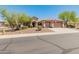 Charming single-story home featuring a three-car garage, desert landscaping, and a welcoming entrance at 2222 W Morse Ct, Anthem, AZ 85086