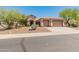 Charming single-story home featuring a three-car garage, desert landscaping, and a welcoming entrance at 2222 W Morse Ct, Anthem, AZ 85086