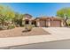 Charming single-story home featuring a three-car garage, desert landscaping, and a welcoming entrance at 2222 W Morse Ct, Anthem, AZ 85086