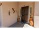 Inviting front porch featuring a secure screen door, decorative vases, and a welcoming ambiance at 2222 W Morse Ct, Anthem, AZ 85086