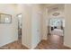 Hallway showcasing access to various rooms with neutral paint and tile flooring at 2222 W Morse Ct, Anthem, AZ 85086