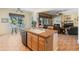 Open kitchen featuring a large island, tile floors, and views of the pool at 2222 W Morse Ct, Anthem, AZ 85086