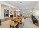 Open-concept living area with neutral tones, a dining area, and views of adjacent rooms, creating a spacious and connected living space at 2222 W Morse Ct, Anthem, AZ 85086
