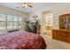 Main bedroom featuring a sitting area, large windows, and ensuite bathroom at 2222 W Morse Ct, Anthem, AZ 85086