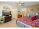 Main bedroom with ceiling fan, large windows, and ample space at 2222 W Morse Ct, Anthem, AZ 85086