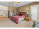 Spacious main bedroom with natural light, ceiling fan, and access to ensuite at 2222 W Morse Ct, Anthem, AZ 85086