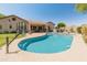 Beautiful backyard pool with basketball hoop, outdoor kitchen, covered patio and lovely desert landscaping at 2222 W Morse Ct, Anthem, AZ 85086