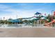 Community pool with fun water slides and shaded seating areas for relaxation at 2222 W Morse Ct, Anthem, AZ 85086