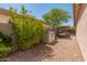 Gravel-filled side yard with storage shed and trailer surrounded by desert foliage at 2222 W Morse Ct, Anthem, AZ 85086