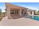 The backyard has a covered patio and pool, providing the ultimate space for relaxation and entertainment at 22463 N 54Th St, Phoenix, AZ 85054