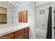 A well-lit bathroom with a shower/tub combo and single sink vanity offers convenience and style at 22463 N 54Th St, Phoenix, AZ 85054
