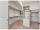 Walk-in closet with custom shelving and organizers and carpeted floor at 22463 N 54Th St, Phoenix, AZ 85054