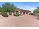 Single Gathering house exterior with mature landscaping, paver driveway, gate and beige stucco at 22463 N 54Th St, Phoenix, AZ 85054