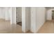 Hallway featuring tiled flooring and white walls and trim at 22463 N 54Th St, Phoenix, AZ 85054