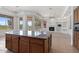 Modern kitchen features stainless appliances, granite counters, and a large island at 22463 N 54Th St, Phoenix, AZ 85054
