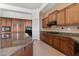 Spacious kitchen featuring wooden cabinets, granite countertops, and stainless steel appliances at 22463 N 54Th St, Phoenix, AZ 85054