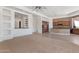 Open living room connects to the kitchen featuring a raised bar and tile floors at 22463 N 54Th St, Phoenix, AZ 85054