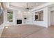An expansive living room featuring built-in shelving and a cozy fireplace at 22463 N 54Th St, Phoenix, AZ 85054