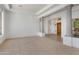 Bright and airy living room with carpet, tall columns and natural light at 22463 N 54Th St, Phoenix, AZ 85054