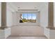 Spacious living room with neutral carpet, light walls, and views of backyard at 22463 N 54Th St, Phoenix, AZ 85054