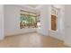 Light-filled living space showcasing a large window with a beautiful courtyard view at 22463 N 54Th St, Phoenix, AZ 85054