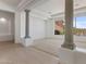 Bright living room featuring neutral tile, large windows and grand columns at 22463 N 54Th St, Phoenix, AZ 85054