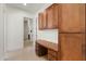 Home office featuring a wood desk, cabinets, and tile flooring at 22463 N 54Th St, Phoenix, AZ 85054