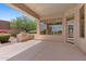 Covered patio with an outdoor grill, offers seamless indoor-outdoor living and scenic views at 22463 N 54Th St, Phoenix, AZ 85054