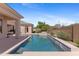 Enjoy this backyard oasis with a sparkling pool and relaxing waterfall feature amidst desert landscaping at 22463 N 54Th St, Phoenix, AZ 85054