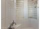 Shower with white tile walls, glass block window and chrome fixtures at 22463 N 54Th St, Phoenix, AZ 85054