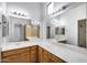 Bright bathroom boasting dual sinks with white countertops and large mirrors at 2250 E Deer Valley Rd # 24, Phoenix, AZ 85024
