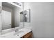 Bathroom with a clean, white vanity, and large mirror at 2250 E Deer Valley Rd # 24, Phoenix, AZ 85024